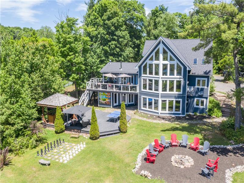 Spectacular Private Retreat on Lake Joseph with 450 feet water frontage with private tennis court