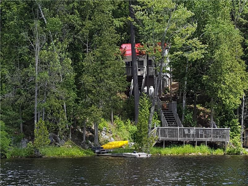 Beautiful Lake front cottage with a canoe and fishing boat