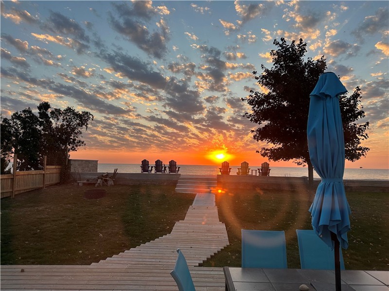 BEACH HOUSE ON LAKE ERIE BY POINT PELEE NATIONAL PARK - SUN RISES OVER LAKE ERIE; SETS BEHIND CANAL