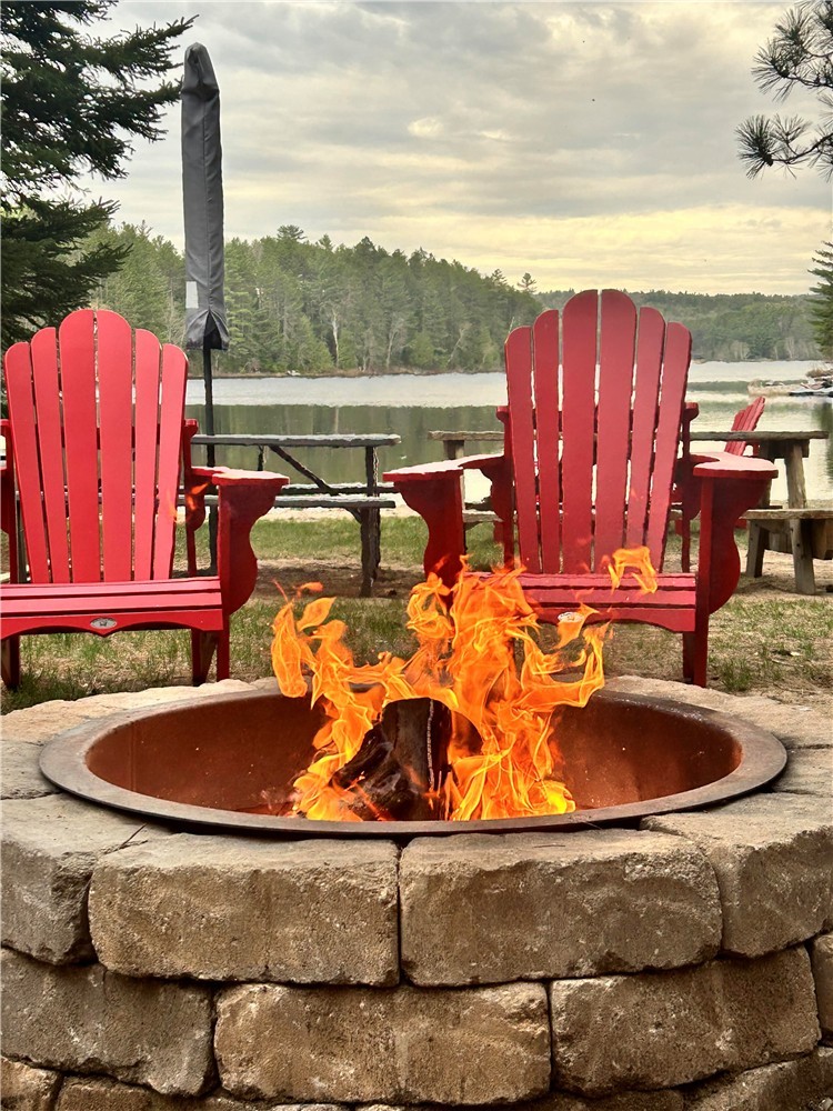NEW PRICE!  Family Cottage on a large flat property with a shallow walk-in waterfront