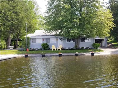 Quiet cottage right on the water with personal boat launch!
