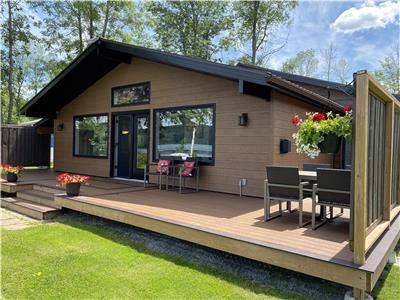 This cottage is nestled on the edge of Sand Lake, Westport and just moments from the village!
