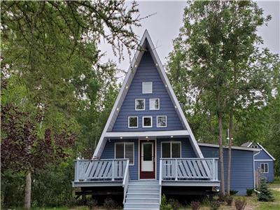 Cozy year round A-Frame with Lake Winnipeg views and steps away from a beautiful sandy beach