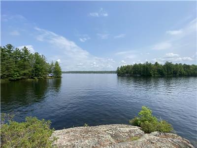 Go Home Lake water access cottage with 700' private shoreline with beach and deep water swimming
