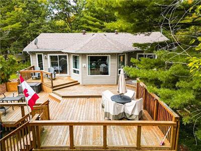 Right on the lake with a huge deck to a  beautiful view of the Serene waters . A private Sauna too!