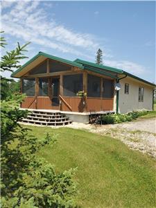 Time for RelaxInn....A cozy cabin on a 40 acre parklike property 15 kms north of Gimli