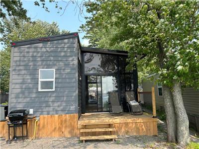 A stunning waterfront modern cottage; small on size but big in style and value!
