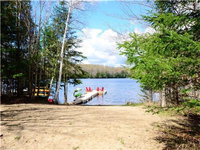 Private Beach front cottage w/ shallow entry. 15 minutes from Haliburton Village! Almost 2 acres!