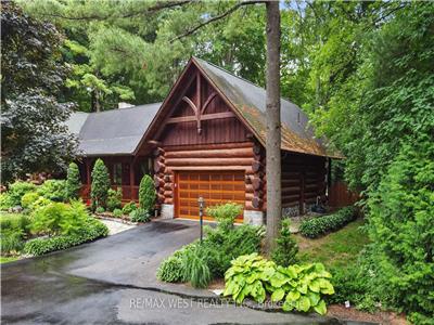 Scandinavian-Style Log Retreat Set on a Stunning 5 Acre Property