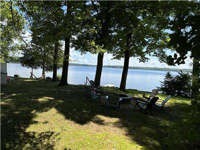 Waterfront cottage with private sandy beach on golden lake perfect for family fun