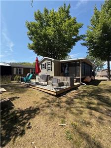 This amazing resort cottage sits on a large site with impressive views of the cove of East Lake!
