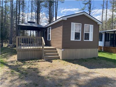 This resort cottage is nestled in a quiet wooded area!