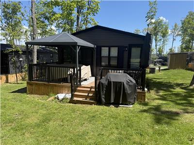 Rare double-wide 3-bed 2-bath cottage situated on a private forest lined lot!